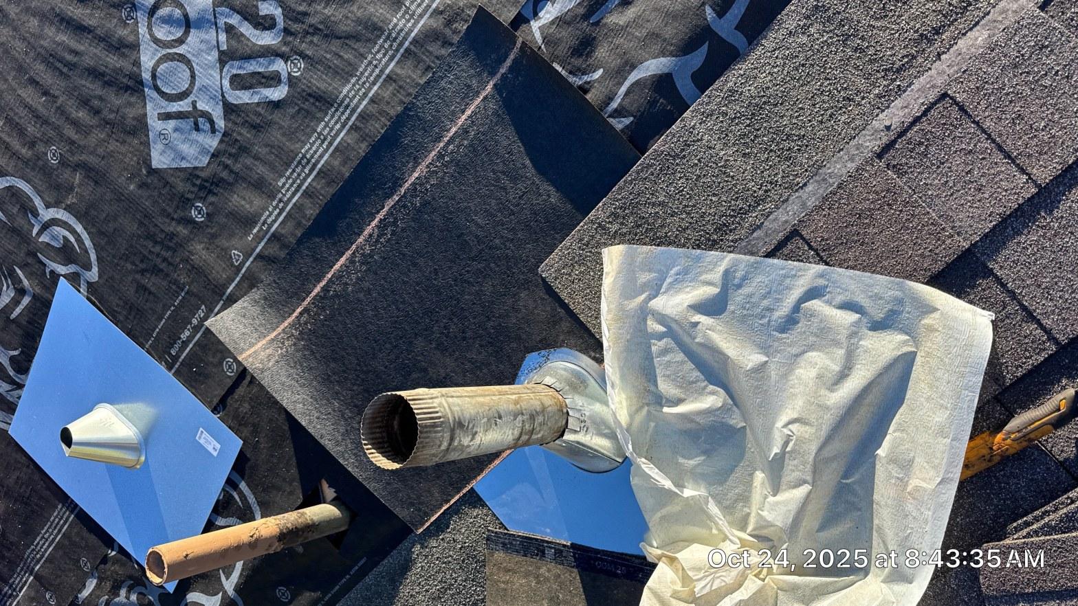 New pipe boot flashing installed over vent pipe on synthetic underlayment during asphalt shingle reroof